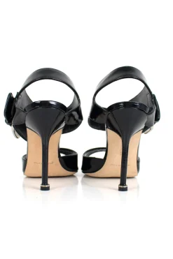 Black patent leather open high-heel pump with silver over-sized buckle detail