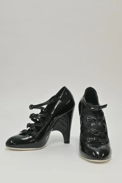 Black patent leather round-toe sculpted Mary Jane pumps