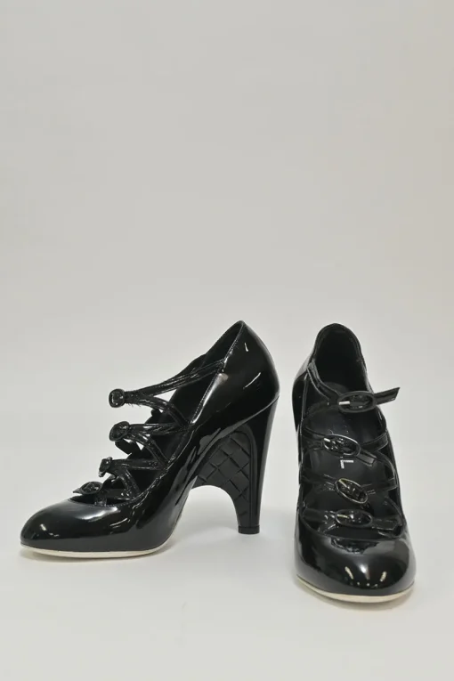 Black patent leather round-toe sculpted Mary Jane pumps