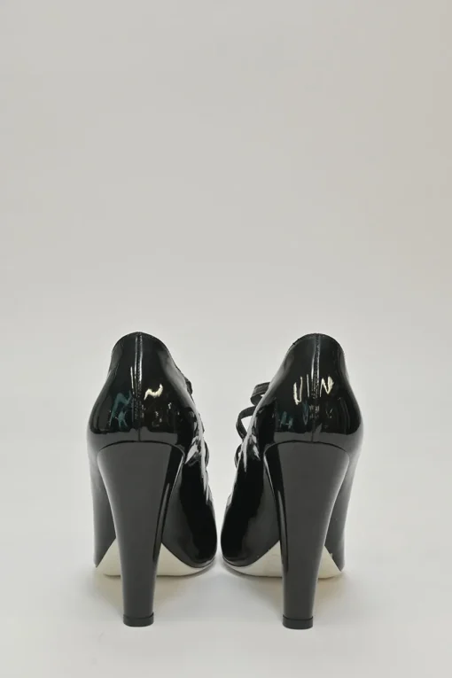 Black patent leather round-toe sculpted Mary Jane pumps