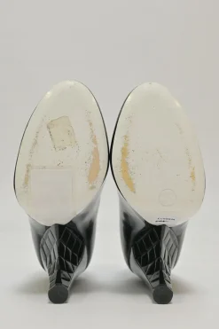 Black patent leather round-toe sculpted Mary Jane pumps