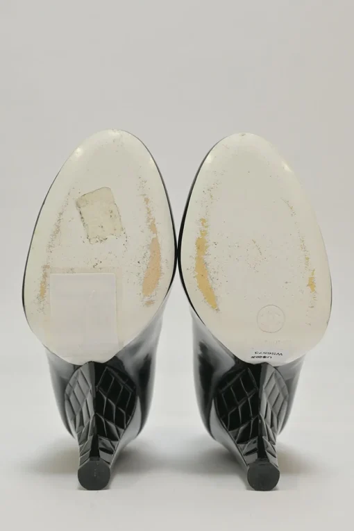 Black patent leather round-toe sculpted Mary Jane pumps