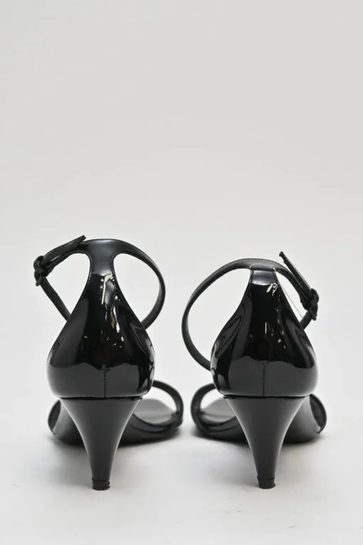 Black patent leather square-toe kitten heel sandals with buckle strap fastening