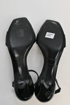 Black patent leather square-toe kitten heel sandals with buckle strap fastening