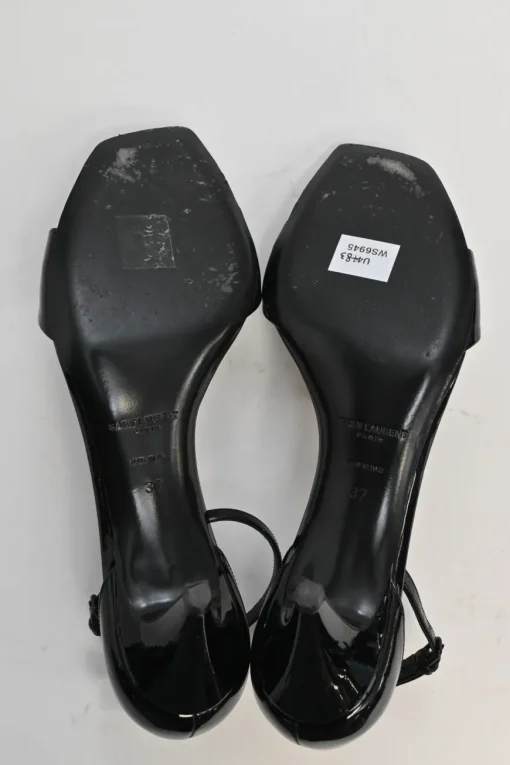 Black patent leather square-toe kitten heel sandals with buckle strap fastening