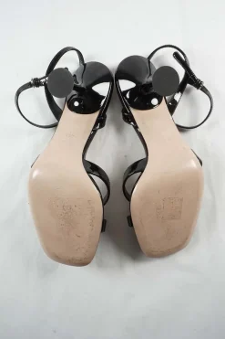Black patent leather strappy bow heeled sandals with adjustable buckle ankle strap