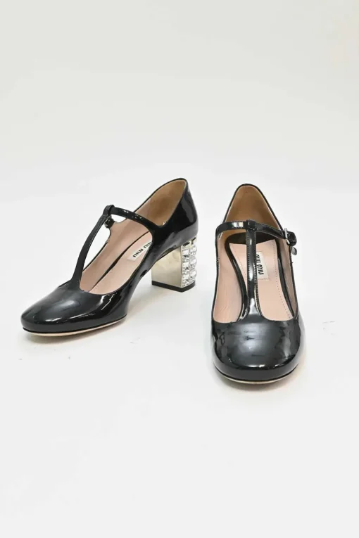 Black patent leather T-strap Mary Jane block heel pumps with crystal-embellished heel