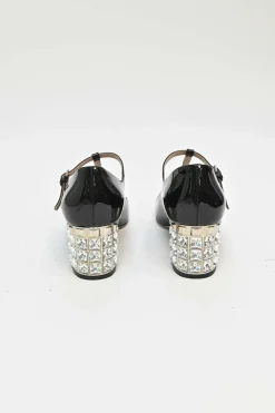 Black patent leather T-strap Mary Jane block heel pumps with crystal-embellished heel