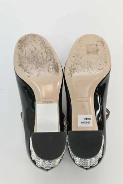 Black patent leather T-strap Mary Jane block heel pumps with crystal-embellished heel