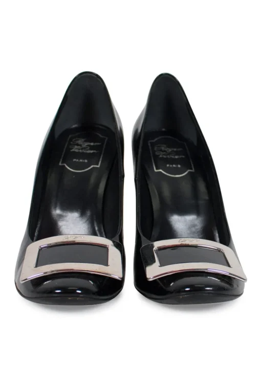 Black patent round toe pump with silver-tone signature square buckle
