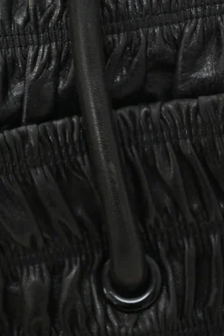 Black patina leather capretto gaufre shoulder flap bag with turn-lock fastening