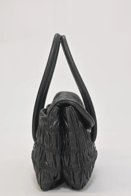 Black patina leather capretto gaufre shoulder flap bag with turn-lock fastening