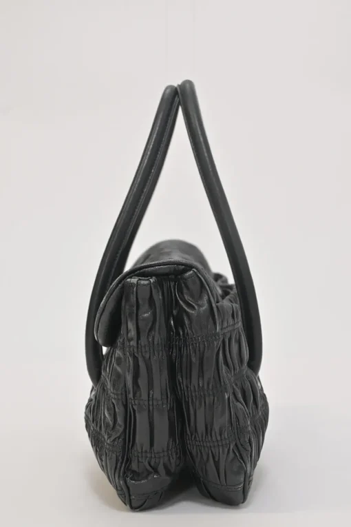 Black patina leather capretto gaufre shoulder flap bag with turn-lock fastening