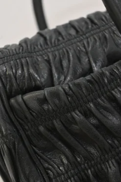 Black patina leather capretto gaufre shoulder flap bag with turn-lock fastening