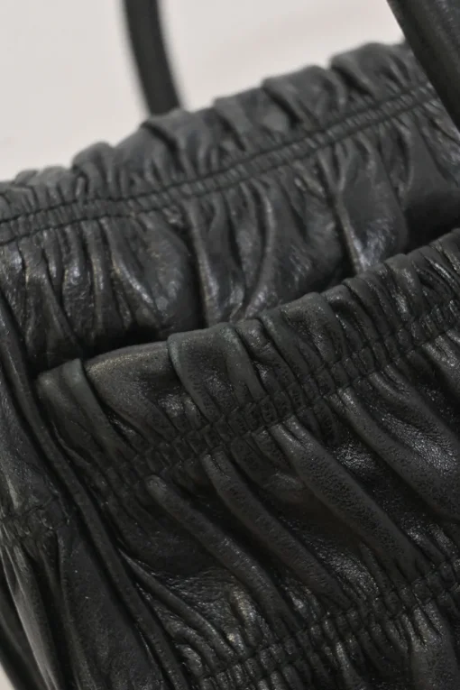 Black patina leather capretto gaufre shoulder flap bag with turn-lock fastening