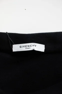 Black pencil skirt with ruffle down one side and silver zip through