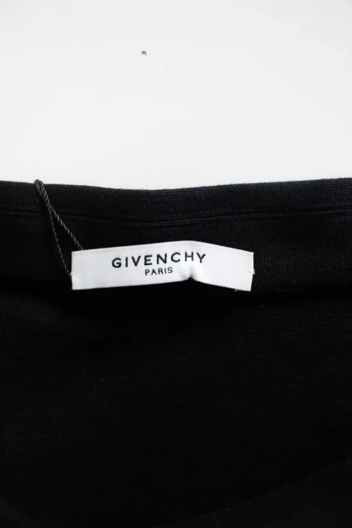 Black pencil skirt with ruffle down one side and silver zip through
