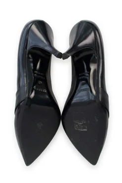 Black pointed toe pumps