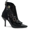 Black polished calfskin and leather pointed toe monk strap-style zip-up ankle booties with ruffle trim