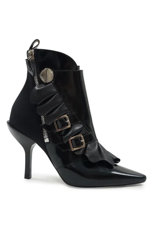 Black polished calfskin and leather pointed toe monk strap-style zip-up ankle booties with ruffle trim