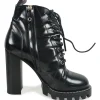 Black polished calfskin and rubber lace-up Star Trail combat-style block heel ankle boots