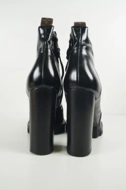 Black polished calfskin and rubber lace-up Star Trail combat-style block heel ankle boots