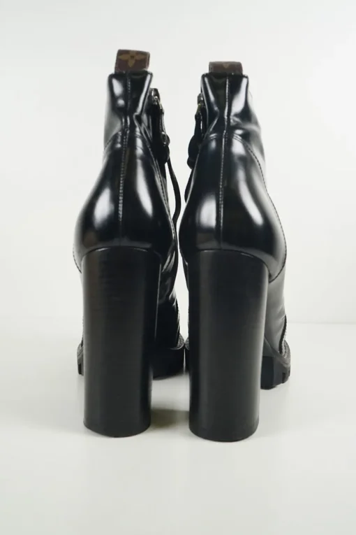 Black polished calfskin and rubber lace-up Star Trail combat-style block heel ankle boots