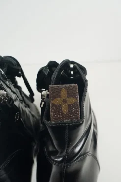 Black polished calfskin and rubber lace-up Star Trail combat-style block heel ankle boots