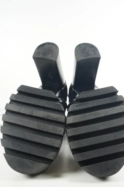 Black polished calfskin and rubber lace-up Star Trail combat-style block heel ankle boots