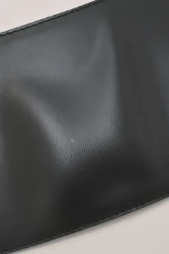 Black polished calfskin harness-style belt with stacked hook and eye closure