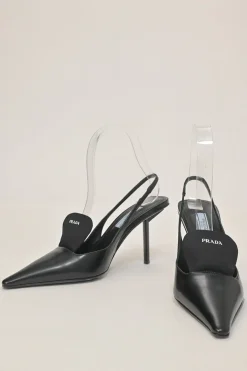 Black polished calfskin pointed-toe logo tongue slingback pumps