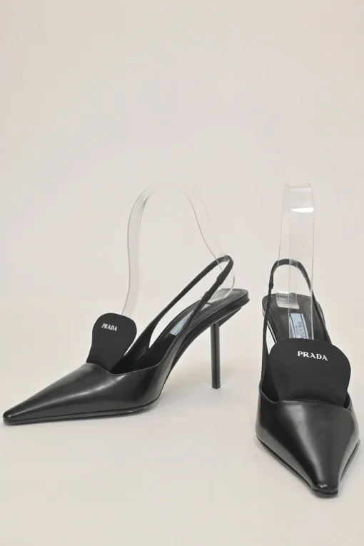 Black polished calfskin pointed-toe logo tongue slingback pumps