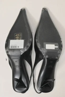 Black polished calfskin pointed-toe logo tongue slingback pumps