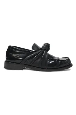 Black polished leather round-toe loafers with knot accents