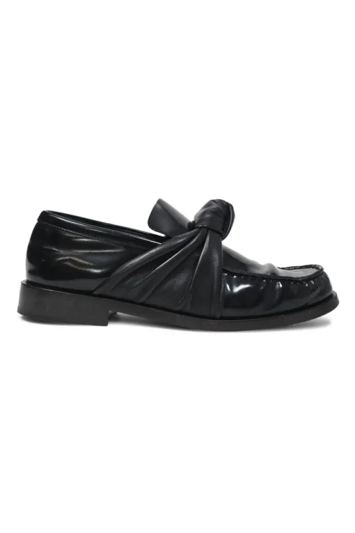 Black polished leather round-toe loafers with knot accents