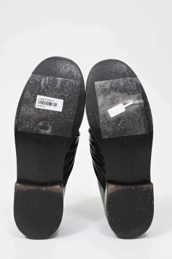 Black polished leather round-toe loafers with knot accents