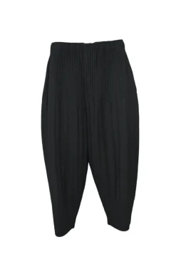 Black polyester pull-on drop-crotch tapered leg pants with elasticated waist