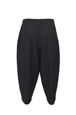 Black polyester pull-on drop-crotch tapered leg pants with elasticated waist