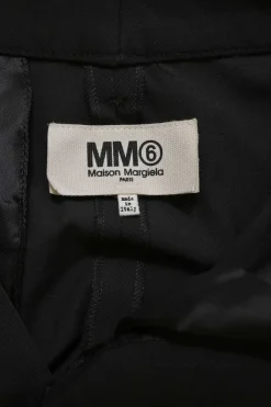 Black polyester-blend high-rise tapered leg tailored trousers with raw-edge hem and contrasting topstitching details