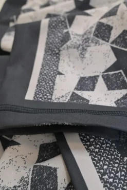 Black polyester-blend patchwork star print pull-on skinny pants