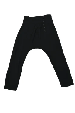 Black rayon pull-on drop-crotch pants with elasticated waistband and side button fly