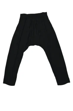 Black rayon pull-on drop-crotch pants with elasticated waistband and side button fly