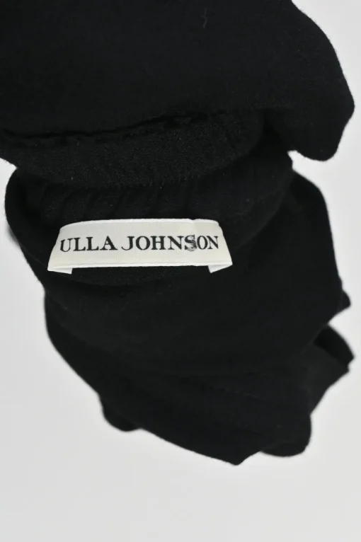 Black rayon pull-on drop-crotch pants with elasticated waistband and side button fly