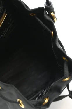 Black re-nylon duet drawstring bucket bag with front zip pocket in gold-tone metallic hardware