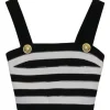 Black silk knit bustier and wrap-front empire waist trousers with signature coat of arms shank buttons