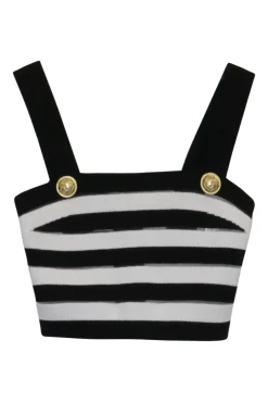 Black silk knit bustier and wrap-front empire waist trousers with signature coat of arms shank buttons