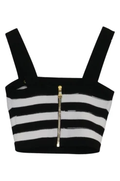 Black silk knit bustier and wrap-front empire waist trousers with signature coat of arms shank buttons