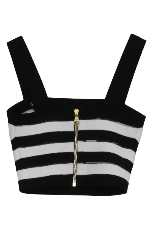 Black silk knit bustier and wrap-front empire waist trousers with signature coat of arms shank buttons