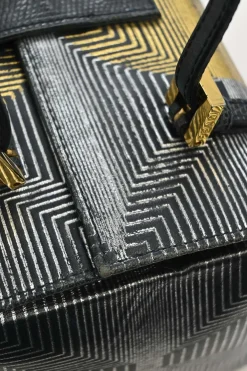 Black, silver, and gold leather shoulder bag with Zucca buckle magnetic snap closure