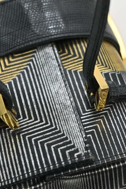 Black, silver, and gold leather shoulder bag with Zucca buckle magnetic snap closure